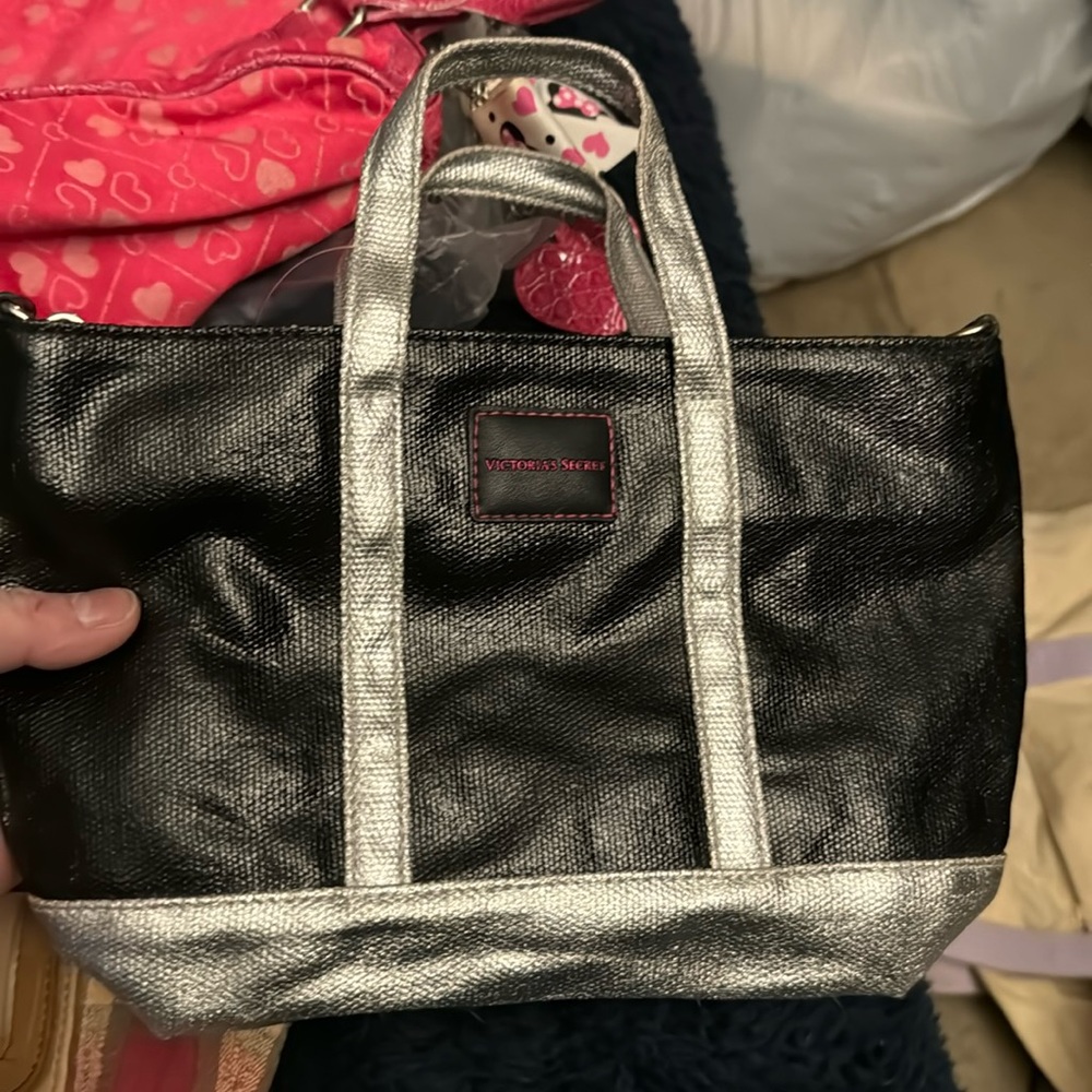 Victoria’s Secret black and silver small purse long handles retails $48 new tags